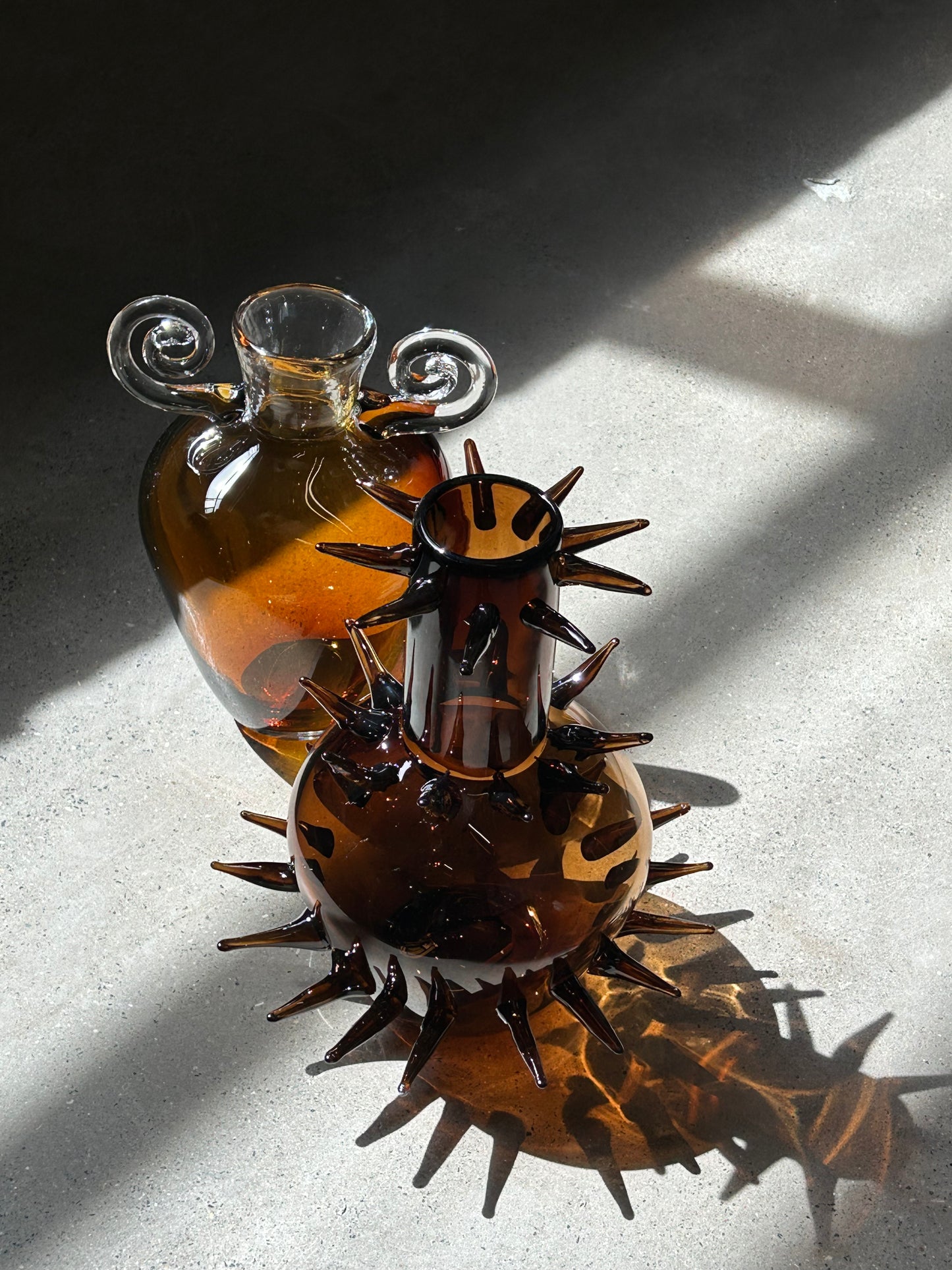 Protected, glass blown vase