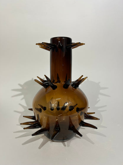 Protected, glass blown vase